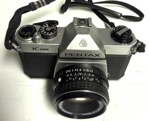 Vintage Pentax K1000 35mm Film SLR Camera with 50mm F2 Lens and other accessories (USED)